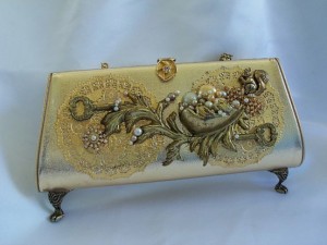 gold purse with feet
