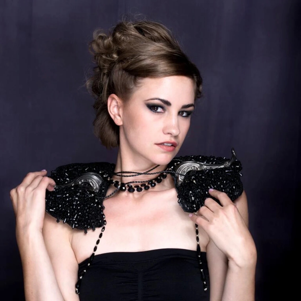 Model wearing black beaded epaulettes made by Marelle Couture for Hopscotch Couture. https://hopscotchcouture.com/ #HopscotchCouture #BeadedEpaulettes #AvantGardeAccessories 