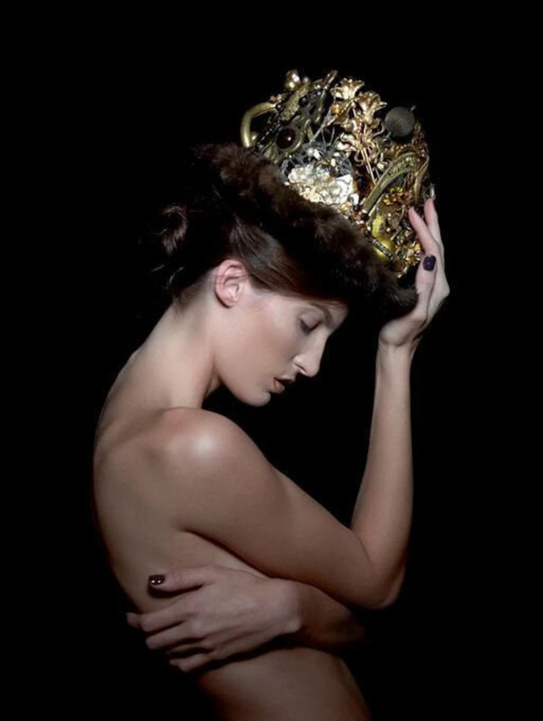 Right Side View of model wearing royal gold crown handmade by Marelle Couture. Made with antique hardware, vintage jewelry and materials. OOAK made to order crowns by Hopscotch Couture. https://hopscotchcouture.com/ #Royalcrown #bridalcrown #handmadecrown