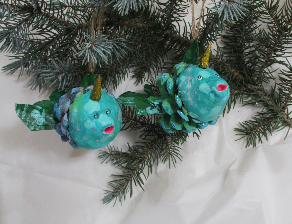 Narwhal Holiday Ornaments made from clay and pinecones by Marelle Couture. https://hopscotchcouture.com/collections/collectables #narwhalornaments #narwhalPinecones #NarwhalChristmasdecorations 