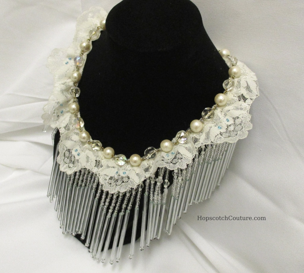 full front top view of glass beaded bib necklace made by Marelle Couture for https://hopscotchcouture.com/ #glassbeadednecklace #beadedbridalbibnecklace 