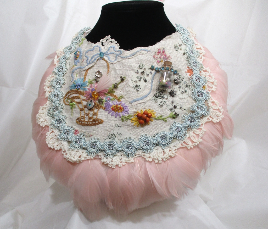 Pink Feather Bib Bridal Necklace by Marelle Couture for Hopscotch Couture. https://hopscotchcouture.com/ #Bridalbibnecklace #featherbibnecklace #handmadebridaljewelry #MarelleCouture
