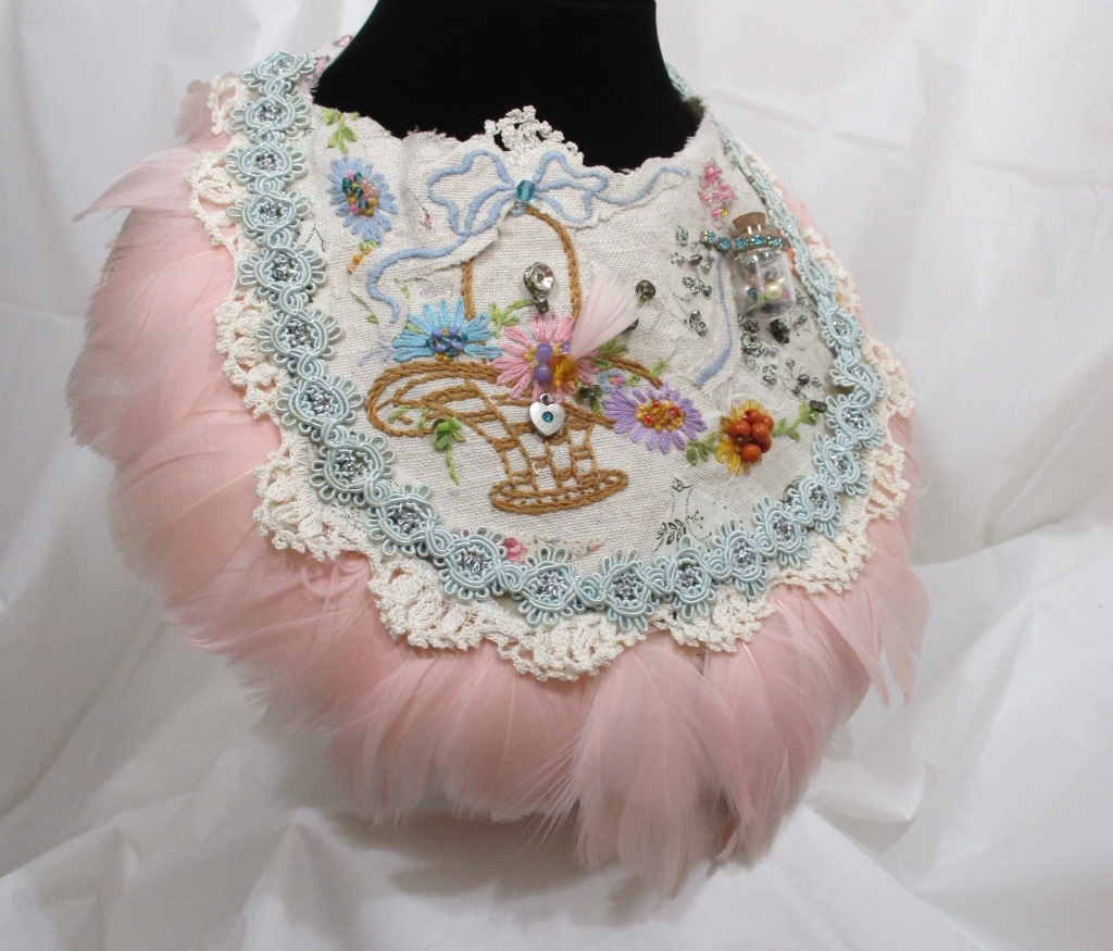 right side view of Pink Feather Bib Bridal Necklace by Marelle Couture for Hopscotch Couture. https://hopscotchcouture.com/ #Bridalbibnecklace #featherbibnecklace #handmadebridaljewelry #MarelleCouture