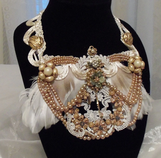 Feather beaded bib neck piece handmade with vintage jewellery by Marelle Couture. https://marellecouture.etsy.com #bridalbibneckpiece #statementjewellery #weddingjewelry