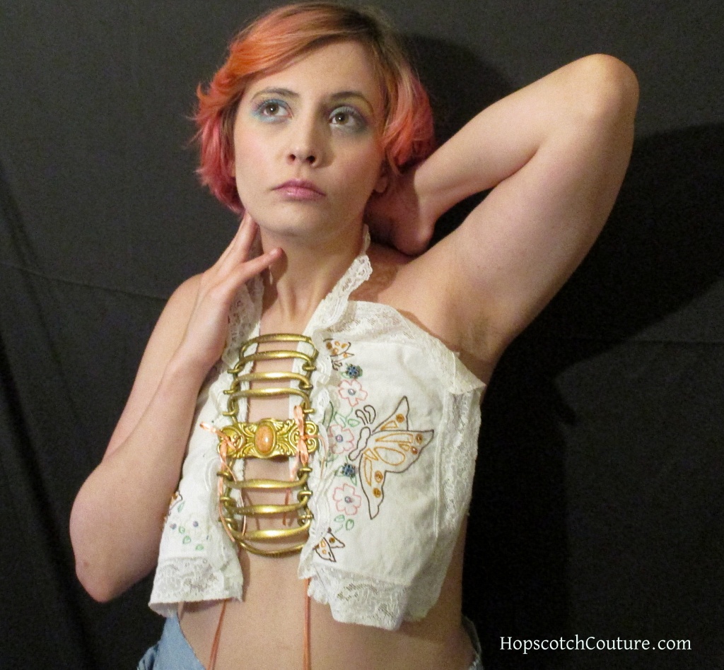 Model wearing halter made with antique hardware and vintage embroidered linen. Handmade by Marelle Couture. https://marellecouture.etsy.com #halter #upcycledfashion #MarelleCouture